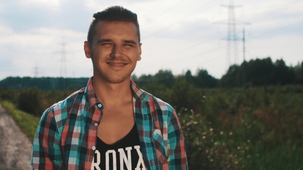 Young Boy In Plaid Shirt Smiling In Camera On Street. Summer Sunny Day. Gladness alt