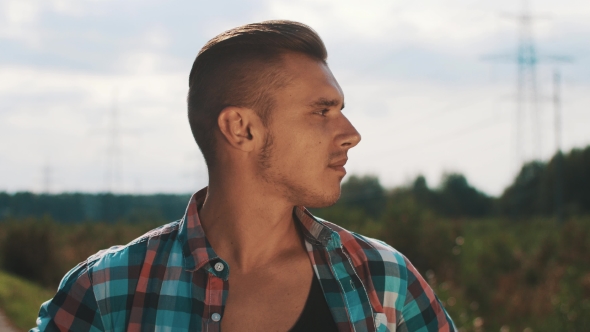 Young Boy In Plaid Shirt Depict Gladness In Camera On Street. Summer Sunny Day. alt