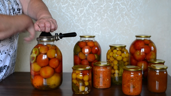 Mature Housewife Closes Banks Of Homemade Preserves