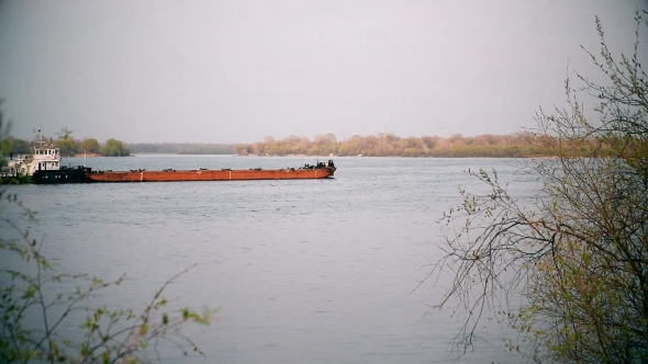 Long Cargo Barge On a River