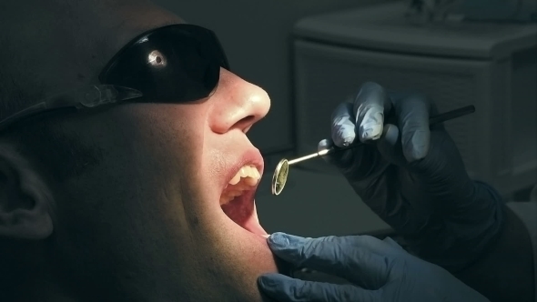 Middle Aged Man Gets Dental Mouth Teeth Treatment