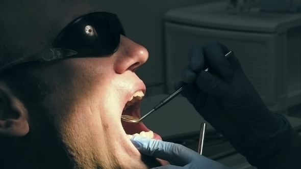Man Gets Dentist Medical Mouth Teeth Treatment