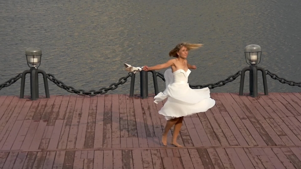 Happy Bride Twisting In Dance On Pier