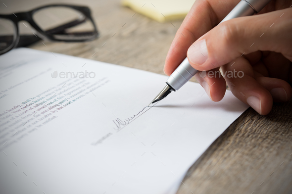 Man signing contract - Stock Photo - Images