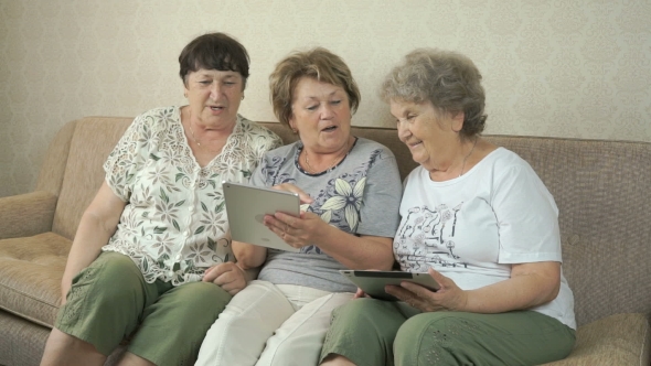 Old Women Holding The Digital Tablets