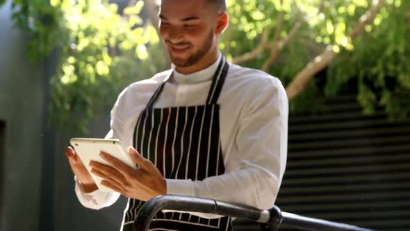 Waiter using digital tablet 4k alt