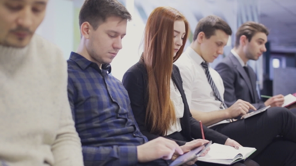  On Employees At Meeting Writing Down Notes. Static Shot  alt