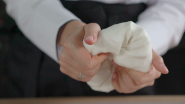 Woman's Hands Knead Sugar Mastic For Making Dessert