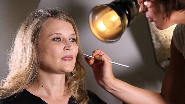 Makeup Artist Applying Make Up on Lips