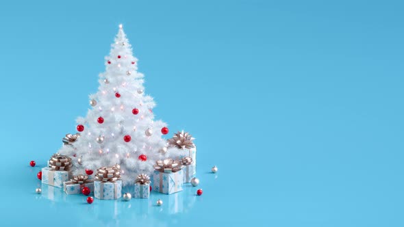 Rotating white Christmas tree with lights and gift boxes