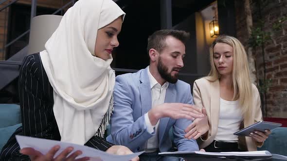 Pleasant Different Ethnicity Business Partners of Man and Two Women which Shaking Hands Thanking alt