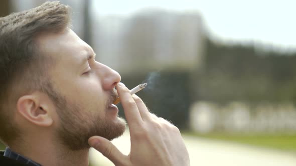 Man Enjoying Smoke Break