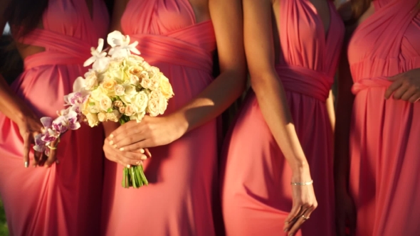 Girlfriend With a Bouquet Of Orchids And Roses In His Hands.