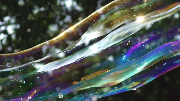 Multi-colored Big Bubble Blower. Bubble Wand. Soap Bubbles Show.