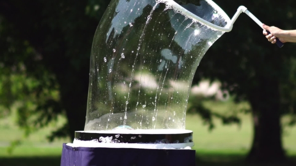 Woman Creates Huge Long Soap Bubbles. Create a Whimsical Bubble