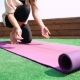 Young Woman Unfolding Mat For Yoga Practice - VideoHive Item for Sale