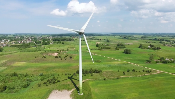 Wind Turbines In Green Fields