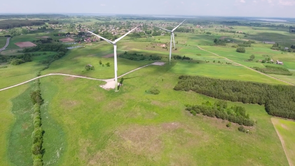 Wind Turbines In Green Fields