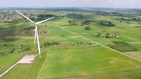 Wind Turbines In Green Fields