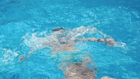 Girl Swimming In The Blue Pool, Stock Footage | VideoHive