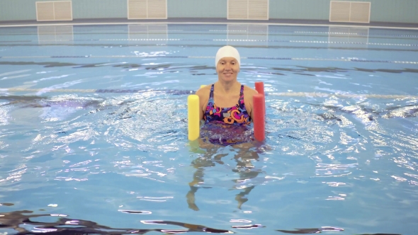 Woman In Aquarobic Fitness Swimming Pool