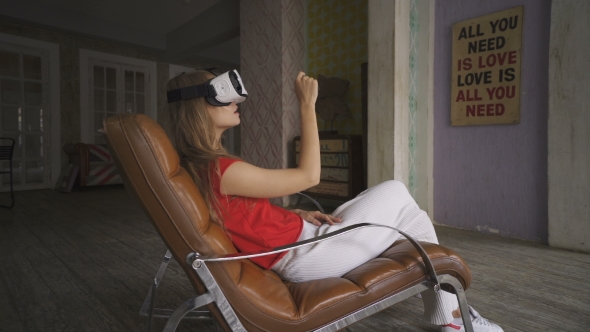 Woman Shopping Online By VR Headset Glasses Of Virtual Reality At Home