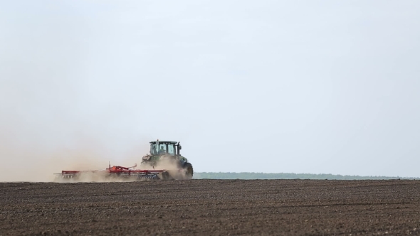 Treatment Of Soil By Using a Plow And Tractor alt