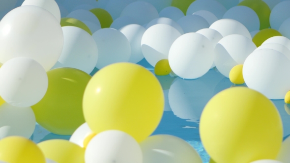 Yellow And White Balloons Floating On The Water alt