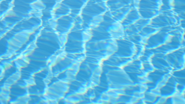 Blue Water In Swimming Pool. Water Motion alt