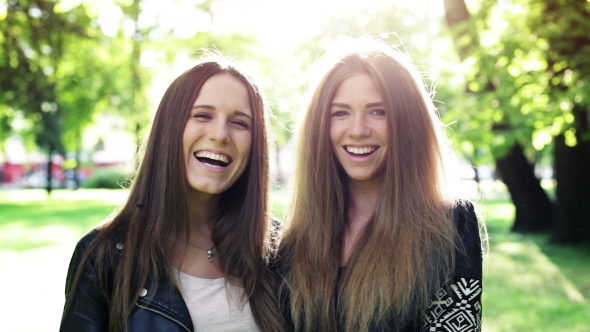 Two Laughing Girls In The City Park, Stock Footage | VideoHive