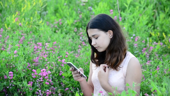 14 Year Girl Uses Phone Outdoors