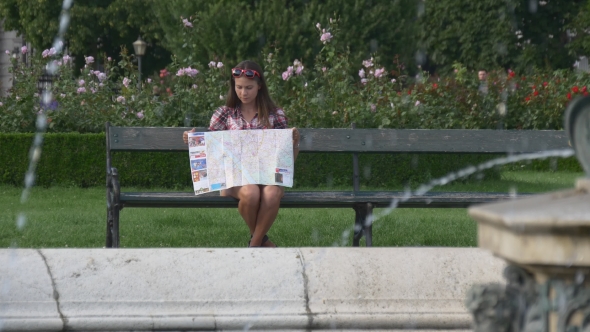 Woman With City Map Travelling In Europe