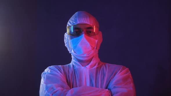 Portrait of a male Researcher in a laboratory in neon blue red light alt
