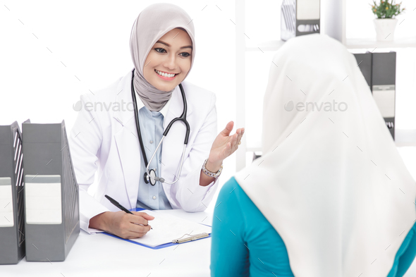 asian female doctor explaining about patient conditions