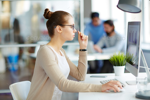 Young Marketing Professional Looking at Data - Stock Photo - Images