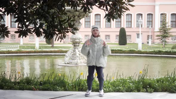 Young Girl Dancing in City Park for Tictok Shooting alt