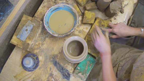 Woman Hands Working on the Potter's Wheel alt