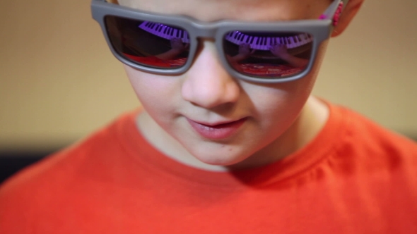 Young Boy Playing On a Synthesizer