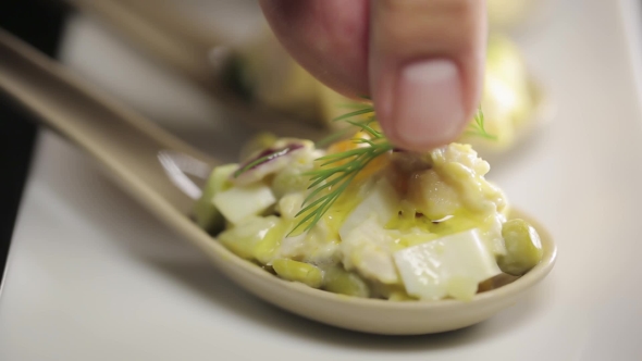Chef Decorates Salad With Dill