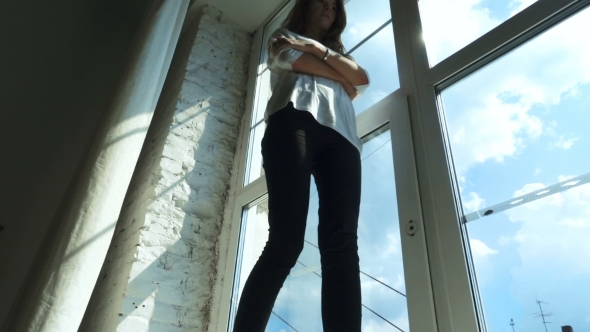 Young Girl Walking On Windowsill alt