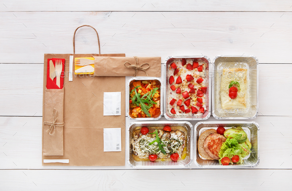 Healthy food take away in boxes, top view at wood - Stock Photo - Images