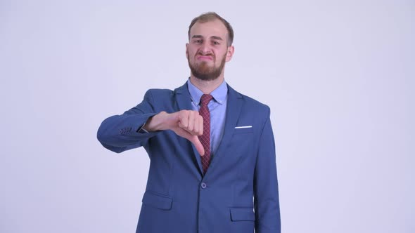 Stressed Bearded Businessman Giving Thumbs Down