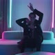 Guy Dancing on Couch in Neon Lights - VideoHive Item for Sale
