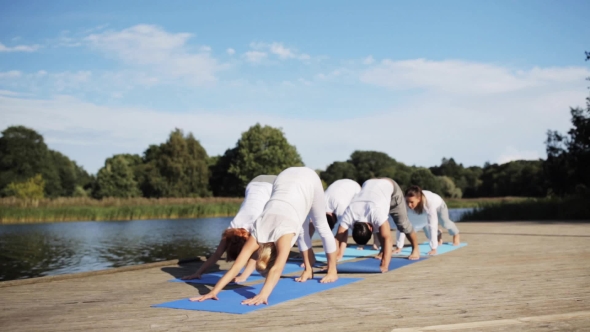 Group Of People Making Yoga Exercises Outdoors 68 alt