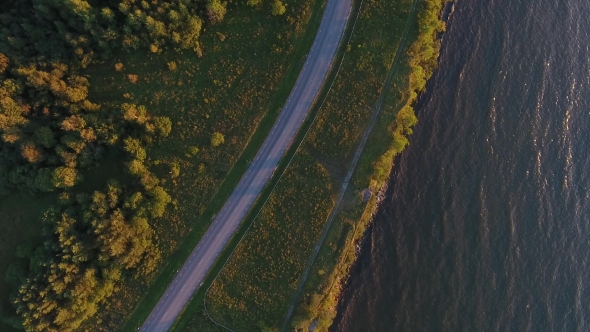 Aerial View To Cliff, Sea And Car Driving On Road 14 alt