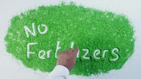 Indian Hand Writes On Green No Fertilizers