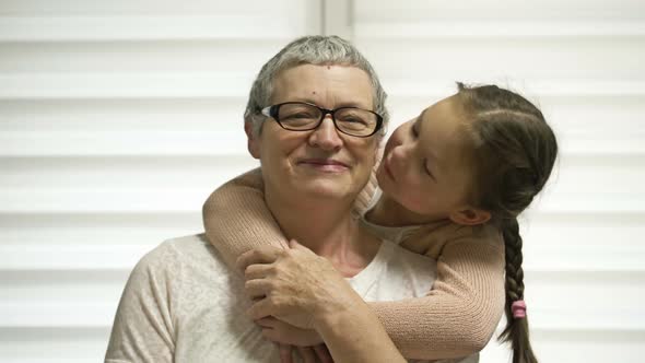 A 78 Year Old Girl Affectionately Hugs Her Elderly Grandmother