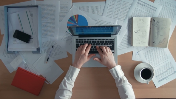 Businessman Working At Office Desk Trying To Type On His Laptop But Its Not Working He