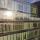 the reflection of the setting sun in the Windows of an office building - VideoHive Item for Sale