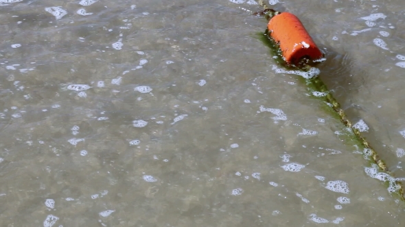 Buoy In The Sea Near Coastline On The Waves alt